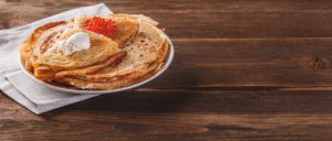 Russian pancakes with red caviar