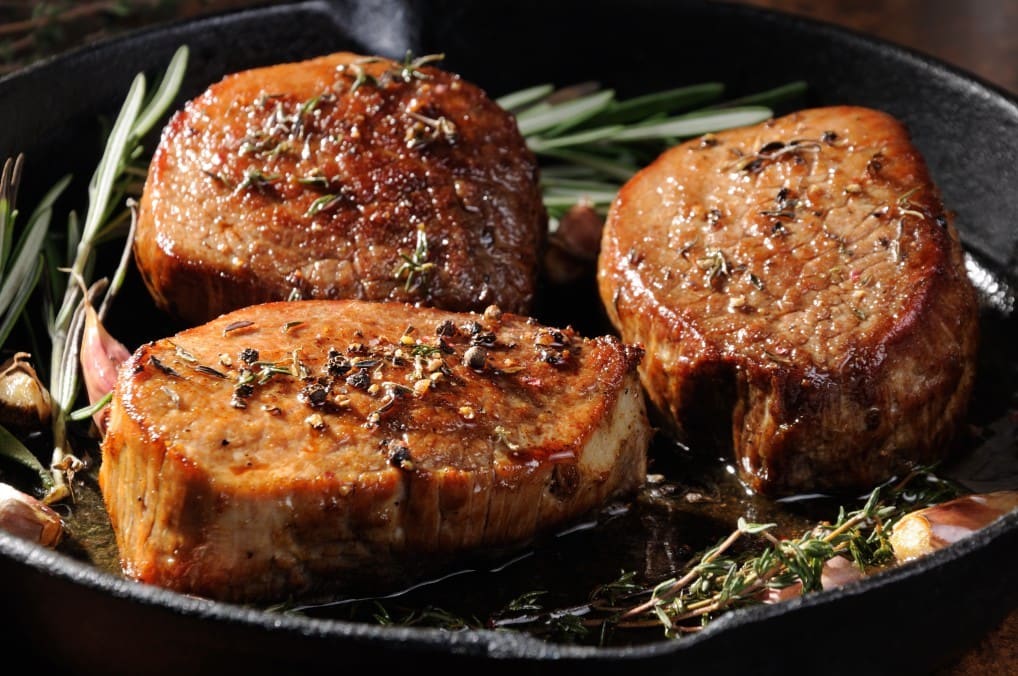 Pork cutlets in cast-iron skillet